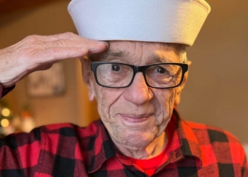 Patriotic Kenny salutes the camera.