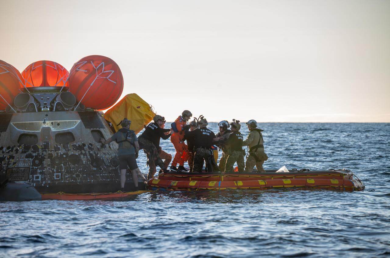 Artemis II Mission Specialist Christina Koch is extracted from NASA’s Orion spacecraft following splashdown in the ocean. 